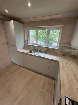 May be an image of kitchen island, cooker hood and indoors