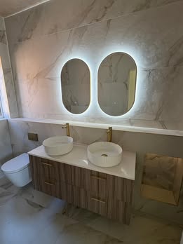 May be an image of lighting, sink and indoors